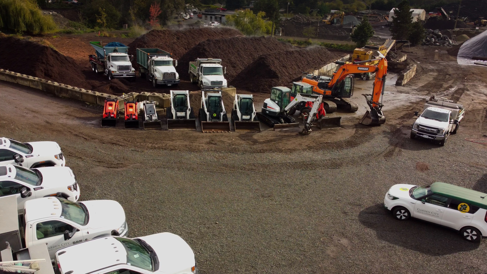 Untitled_1.1.1 Drone photo of Garden City yard with machines, vehicles, and mulch piles